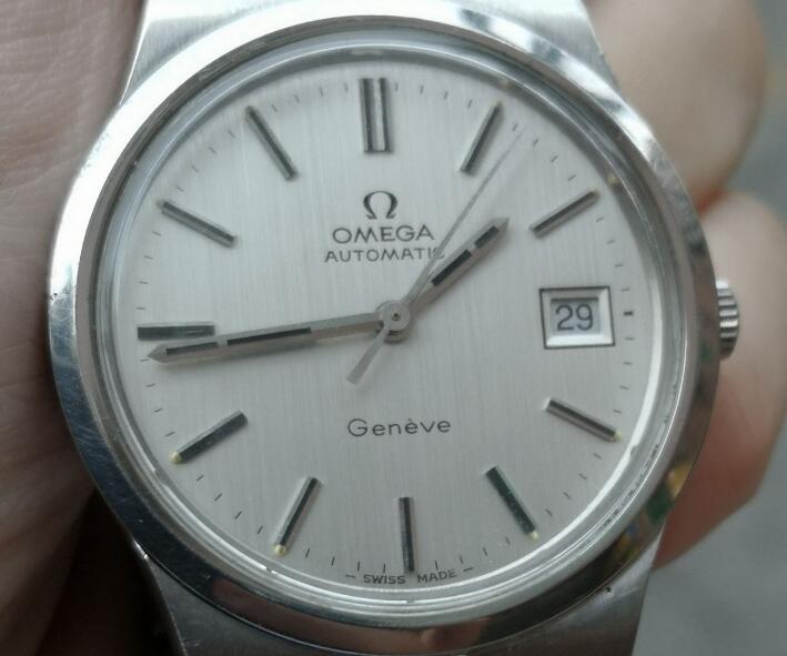 The Omega watch is elegant and understated.