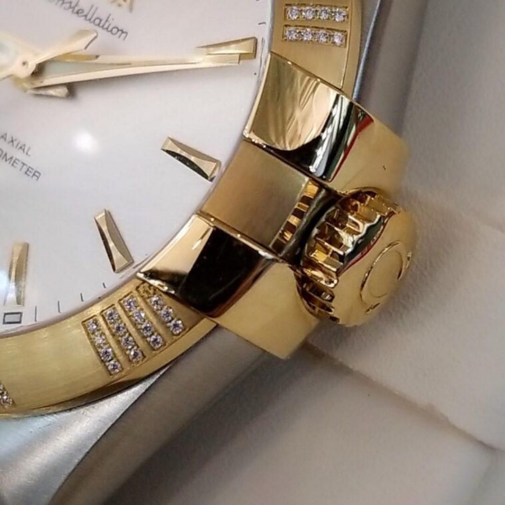 The 38 mm fake watch is decorated with diamonds.