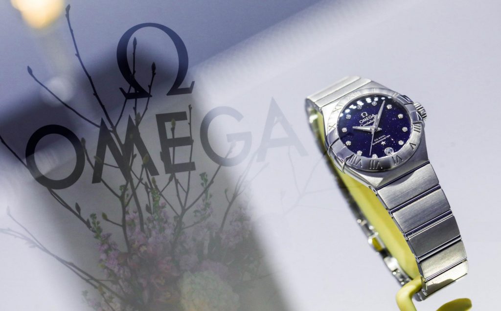 The blue dial fake watch is decorated with diamonds.